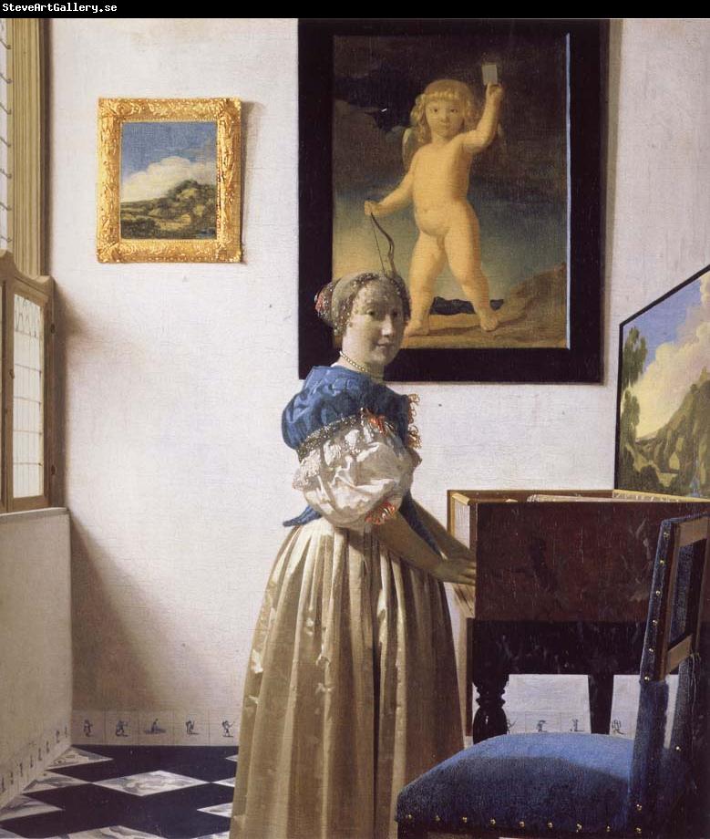 JanVermeer A Young Woman Standing at a Virginal